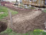 Stream, with extra dirt sloping away and backfilled around pond.JPG