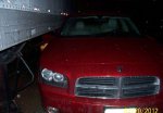 Charger up against trailer, rear view mirror caught underneath - Copy.JPG