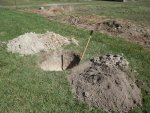 Completed hole and dirt rock piles.JPG Completed hole and dirt rock piles.JPG