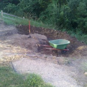 This area used to be a vegetable garden, fairly significant slope. Goal is to just use cut and fill to create natural earthen berm.
