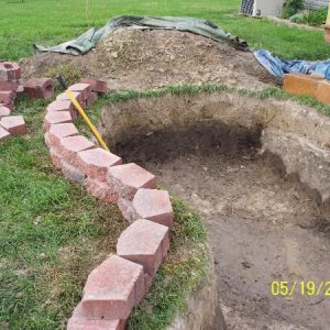 laying landscape stones and bog area to be created in that curve