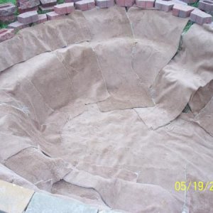 Found 1 year old carpet that was being replaced!  Lining entire pond over block and landscape stones on all edges
