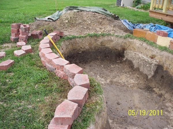 laying landscape stones and bog area to be created in that curve