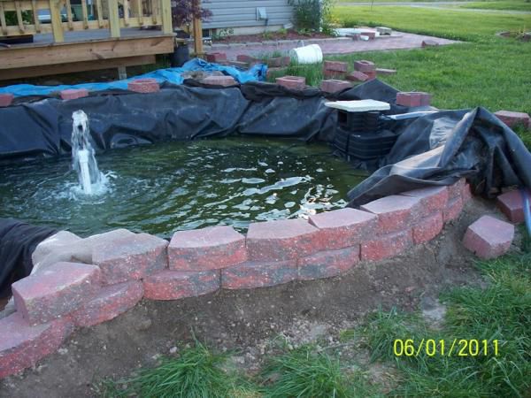 Outside wall getting completed - oops, I noticed the liner was slipping under the water level!