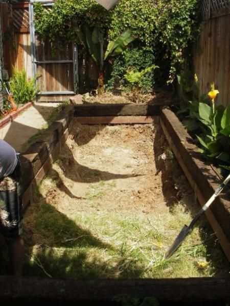 We used railroad ties as the frame.. and we were limited by the space we had on our side yard. I know.. railroad ties are nice looking but highly toxic. I had to carefully overlap the liner once we had it all in.